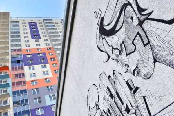 Нанесенный рисунок на стене здания Граффити на стене