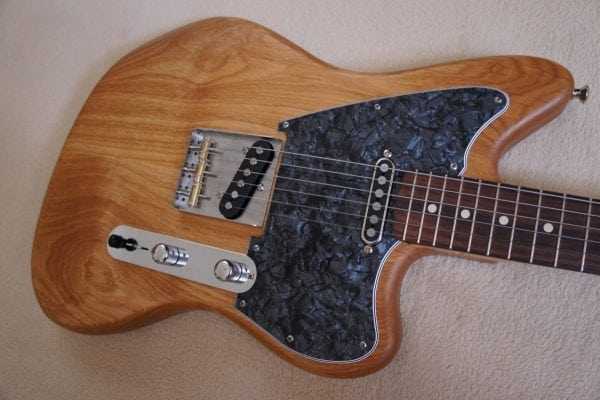 Гитара покрытая тунговым маслом Тунговое масло используется для отделки музыкальных инструментов